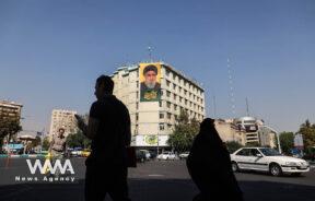 A billboard with a picture of the late Lebanon's Hezbollah leader Hassan Nasrallah is displayed on a building