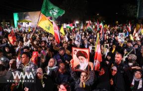 Iranians celebrate on a street after the IRGC attack on Israel