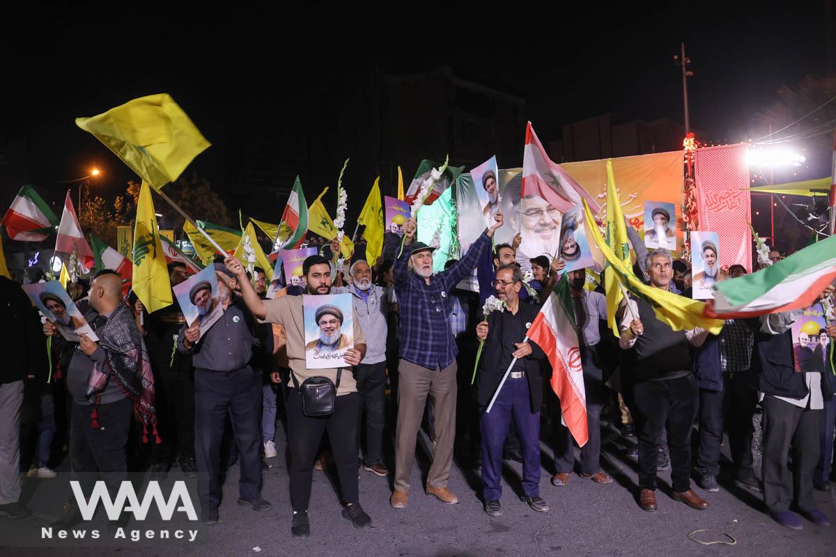 Iranians celebrate on a street after the IRGC attack on Israel