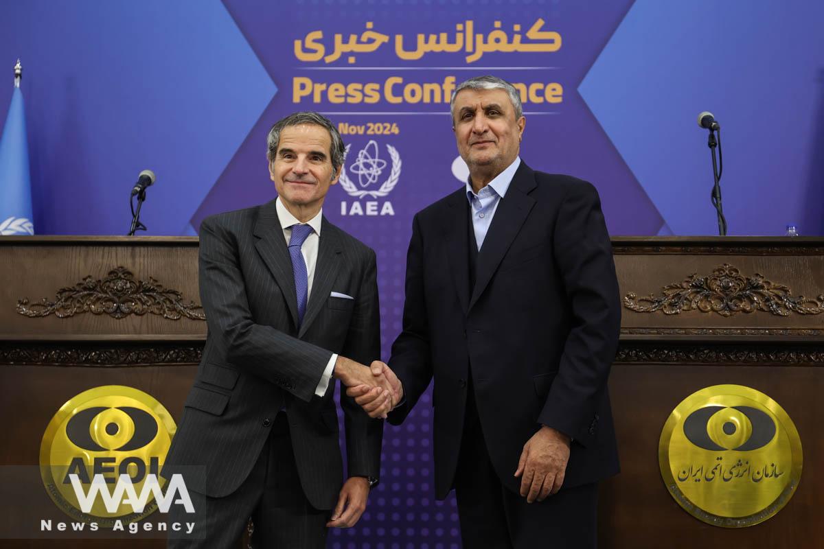International Atomic Energy Agency (IAEA) Director General Rafael Mariano Grossi and Head of Iran's Atomic Energy Organization Mohammad Eslami attend a news conference in Tehran