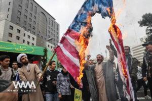 Iranians burn a U.S. flag during the 45th anniversary of the U.S. expulsion from Iran