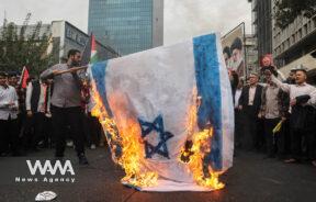 Iranians burn an Israeli flag during the 45th anniversary of the U.S. expulsion from Iran