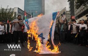 Iranians burn an Israeli flag during the 45th anniversary of the U.S. expulsion from Iran