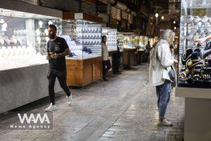 An Iranian woman looks at jewelry displayed in a store in Tehran