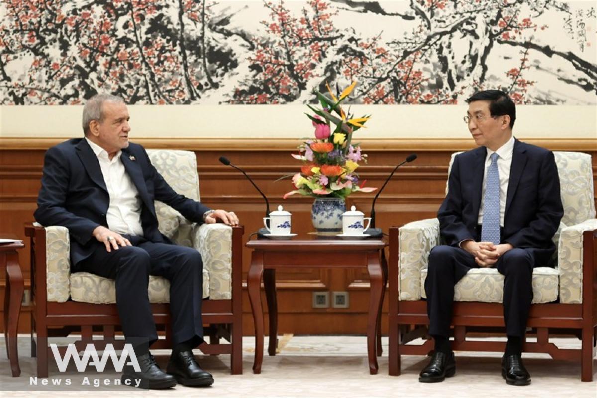 Masoud Pezeshkian in a meeting with Huang Hou. Social Media / WANA News Agency